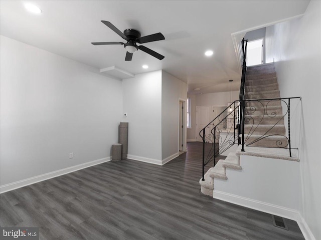 interior space with dark hardwood / wood-style floors and ceiling fan