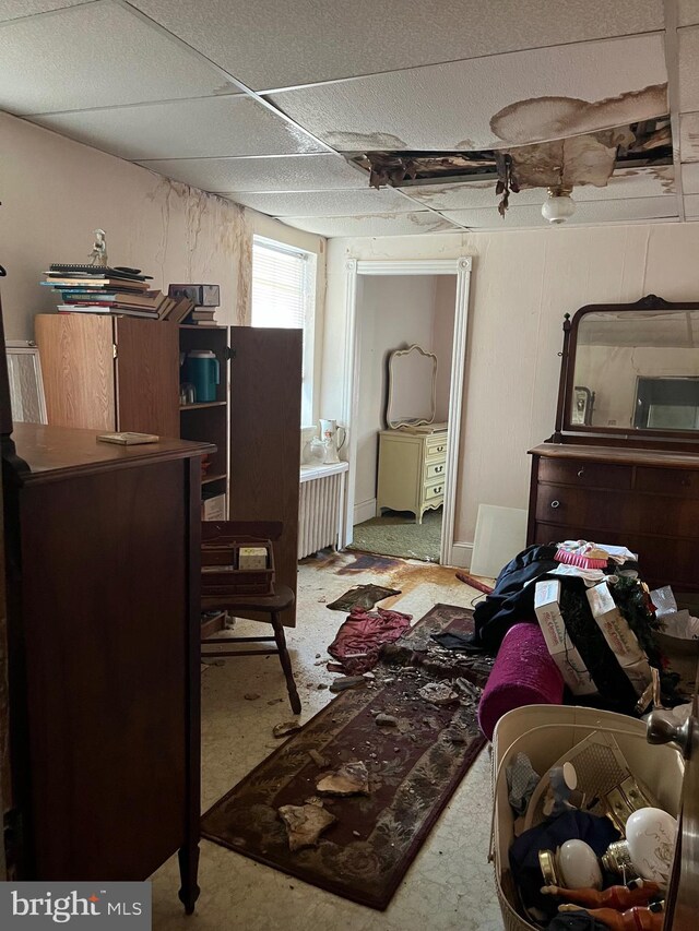 carpeted bedroom featuring radiator