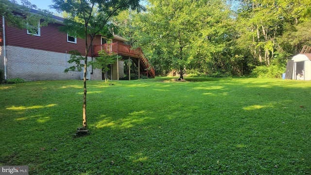 view of yard with a deck