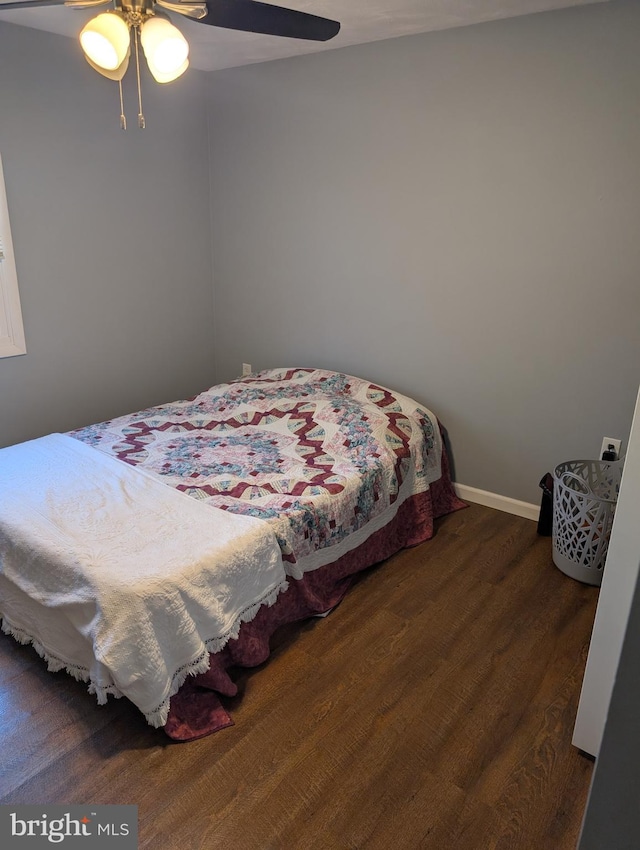 bedroom featuring dark wood-type flooring and ceiling fan