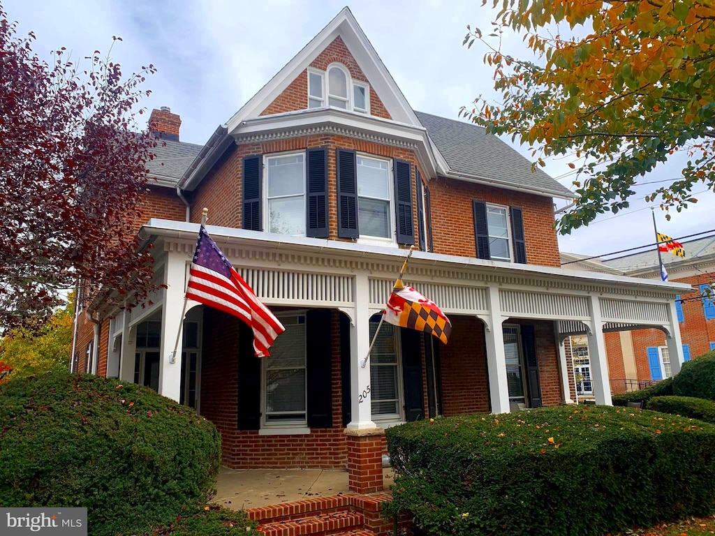 victorian house featuring a porch