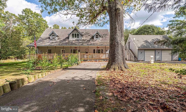 view of front of house featuring covered porch and a garage