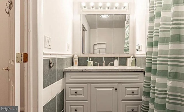 31 S Jersey Ave, Dorothy, NJ 08317 - bathroom with curtained shower, tile walls, a wainscoted wall, and vanity