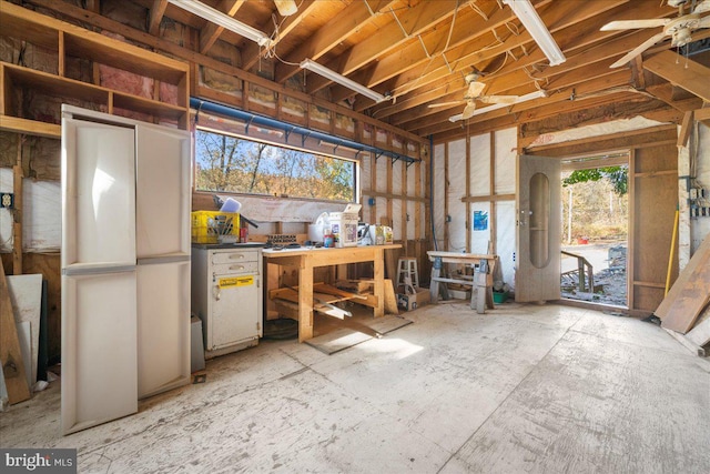 misc room featuring a workshop area and ceiling fan