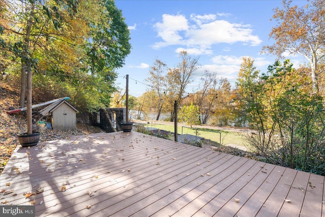 deck featuring a shed