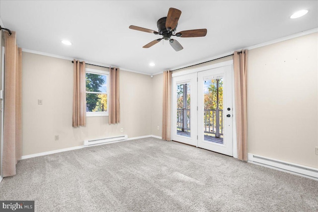 carpeted empty room featuring a healthy amount of sunlight, baseboard heating, and ceiling fan