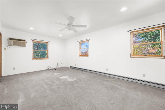 empty room featuring a baseboard radiator, a wall mounted air conditioner, light colored carpet, and ceiling fan