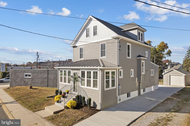 front facade featuring an outdoor structure and a garage