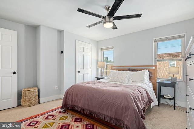 carpeted bedroom featuring ceiling fan