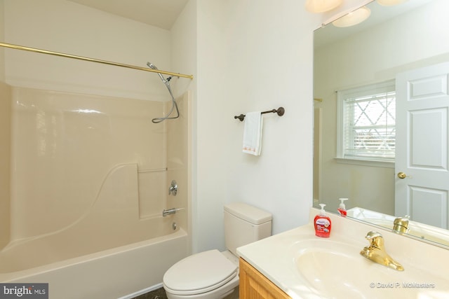 full bathroom featuring vanity, bathtub / shower combination, and toilet