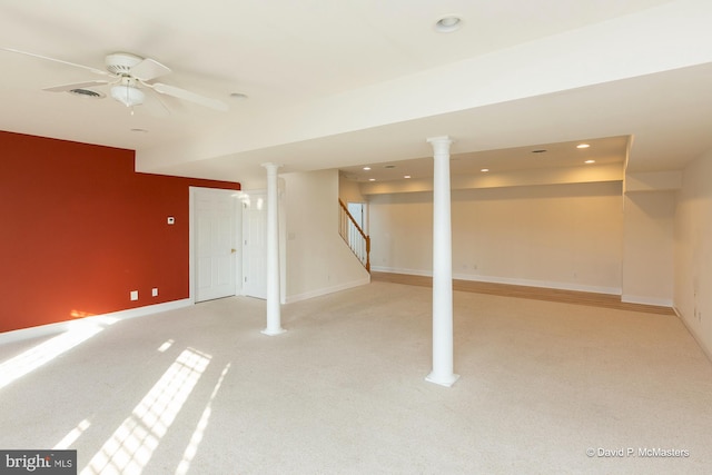 basement with light colored carpet and ceiling fan