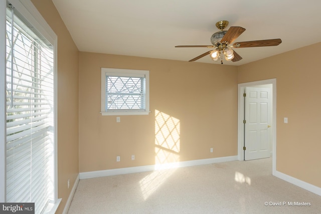 carpeted empty room with ceiling fan