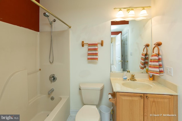 full bathroom with vanity, toilet, and washtub / shower combination