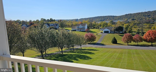 exterior space with a yard and a mountain view