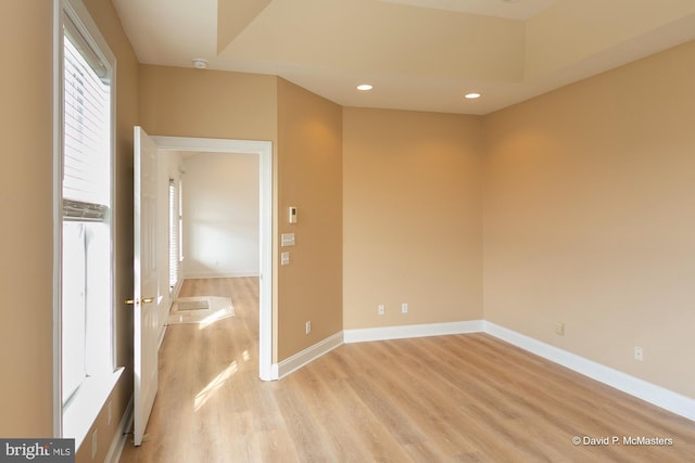 spare room featuring light hardwood / wood-style flooring