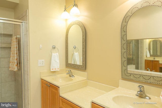 bathroom featuring vanity and a shower with shower door