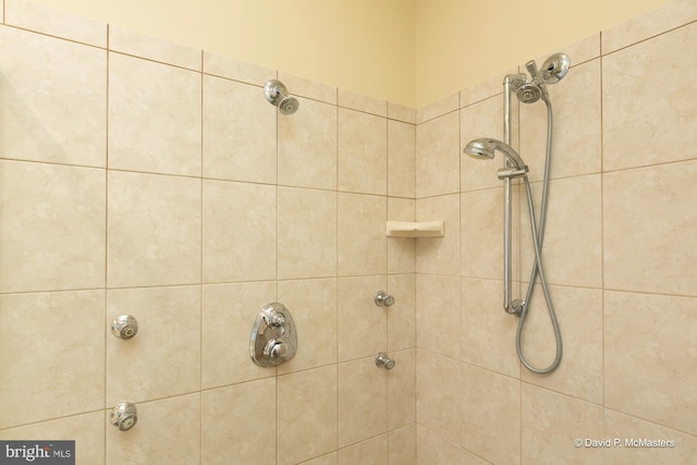 bathroom with a tile shower