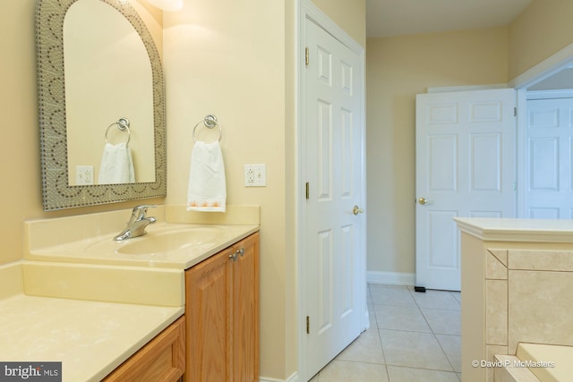 bathroom with tile patterned flooring and vanity