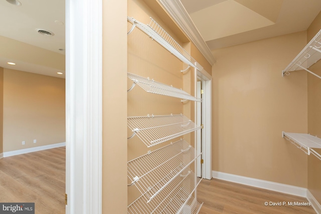 spacious closet featuring light hardwood / wood-style flooring