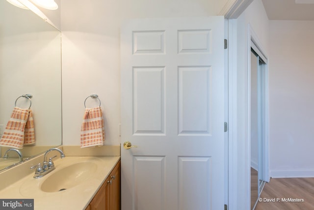 bathroom with vanity and wood-type flooring