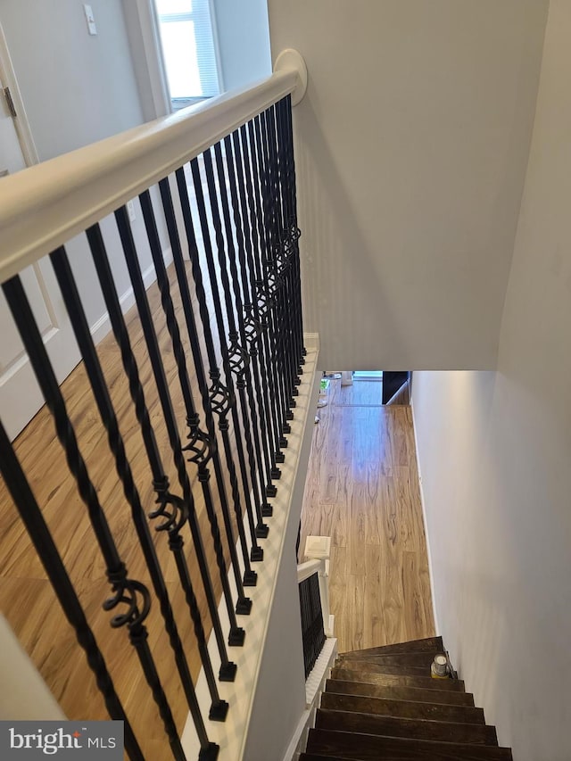 stairs with wood finished floors