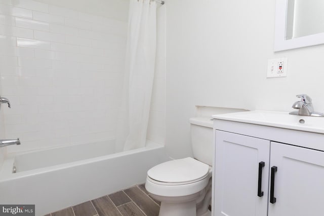 full bathroom with vanity, toilet, and shower / tub combo