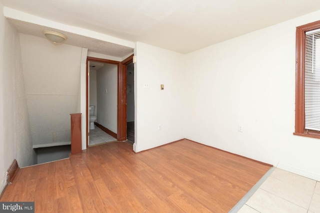 empty room with hardwood / wood-style floors