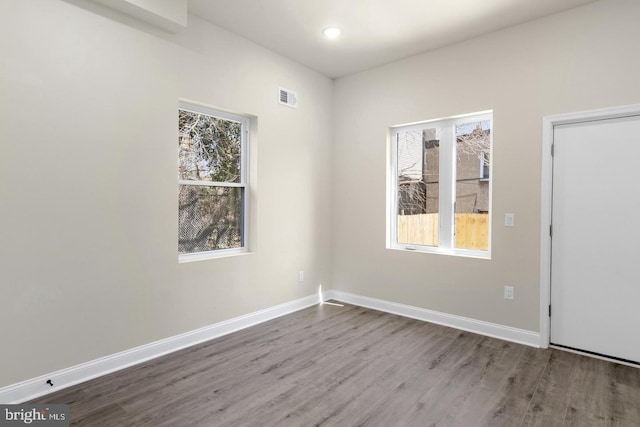 empty room featuring hardwood / wood-style floors