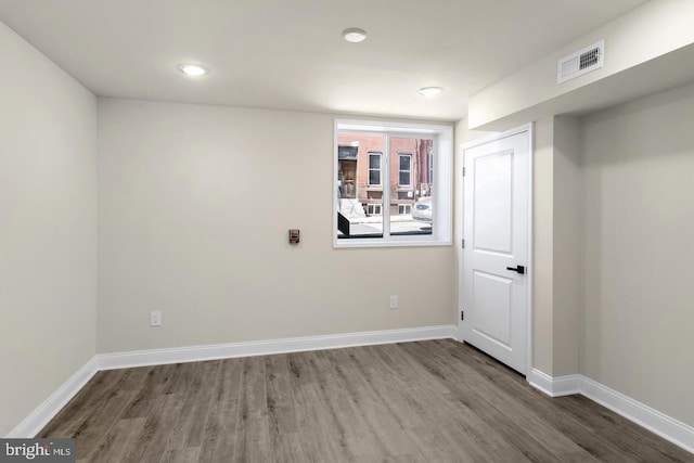 spare room featuring hardwood / wood-style floors