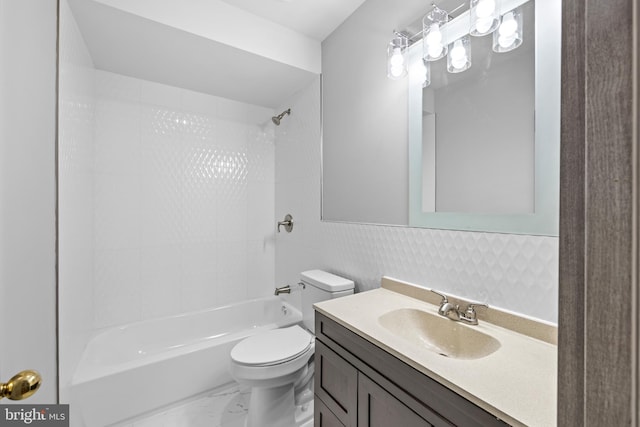 full bathroom with vanity, toilet, and tiled shower / bath combo