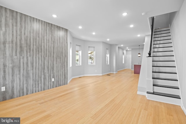 unfurnished living room with light wood-type flooring