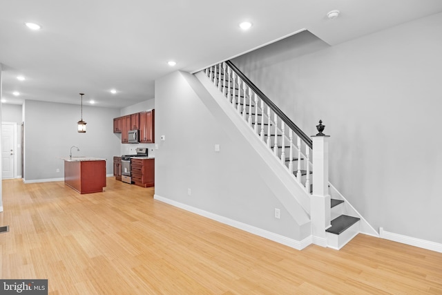 interior space with wood-type flooring and sink