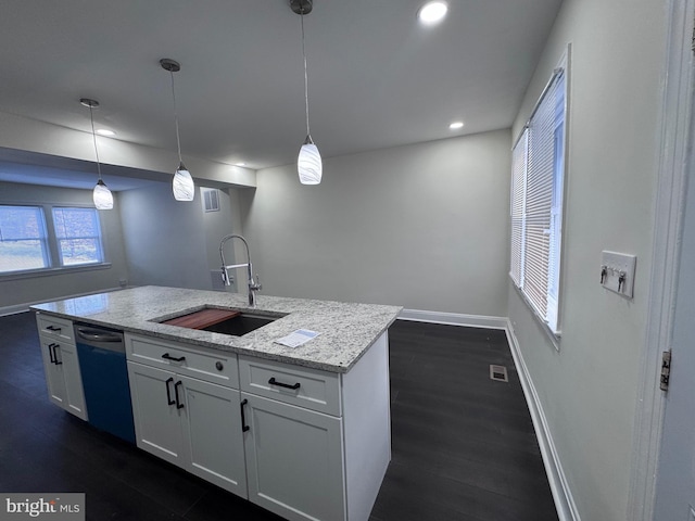 kitchen featuring dishwasher, sink, decorative light fixtures, light stone counters, and white cabinetry