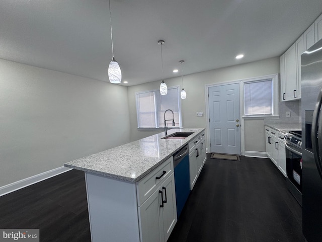 kitchen with sink, tasteful backsplash, decorative light fixtures, white cabinetry, and stainless steel appliances