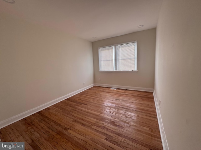 spare room featuring hardwood / wood-style floors