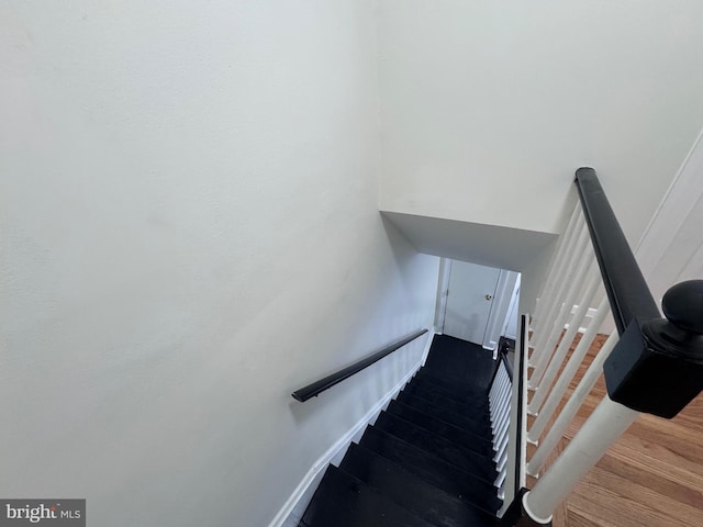 staircase featuring hardwood / wood-style floors