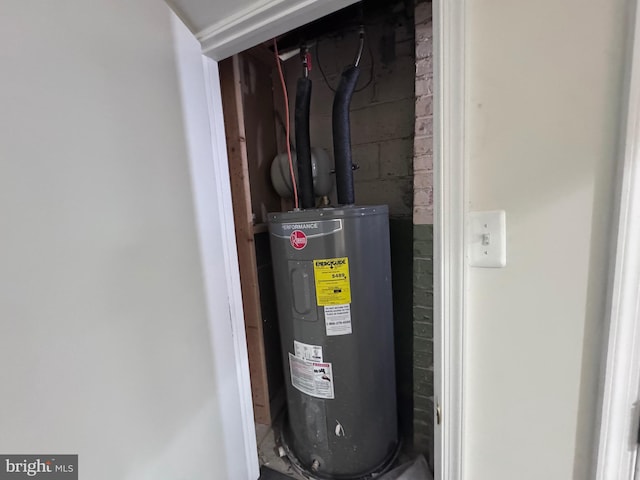 utility room with electric water heater