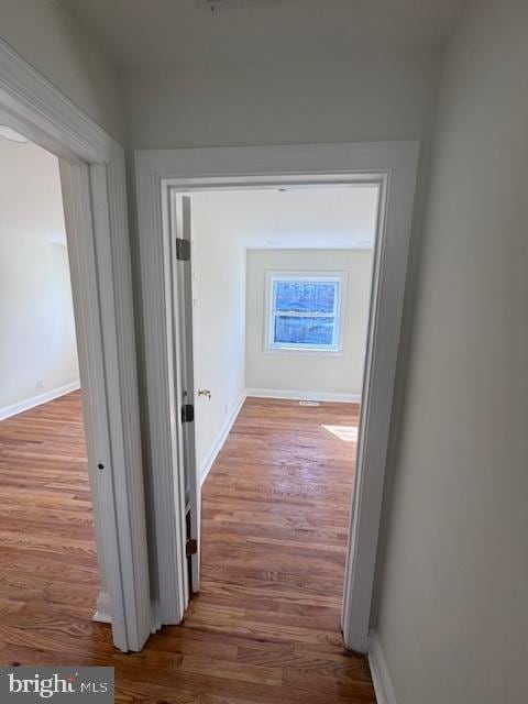 hallway featuring hardwood / wood-style floors