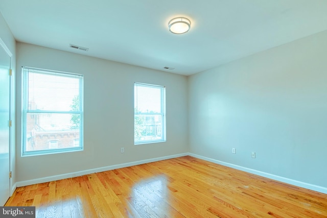 spare room featuring light hardwood / wood-style flooring