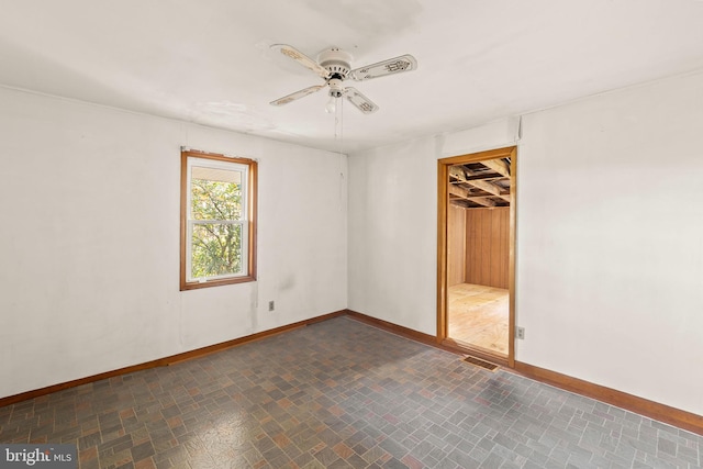 unfurnished bedroom with a closet, ceiling fan, and a walk in closet