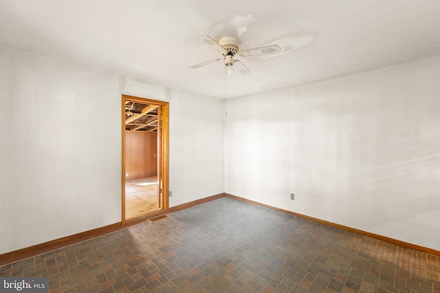 unfurnished bedroom with a closet, a spacious closet, and ceiling fan