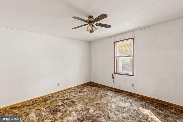 spare room with carpet flooring and ceiling fan