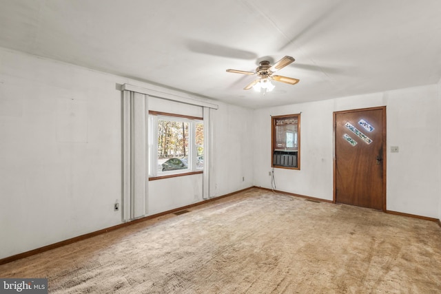 empty room with light carpet and ceiling fan