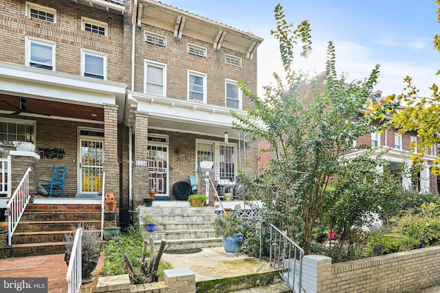 multi unit property featuring a porch