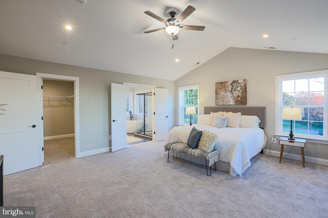 bedroom with a spacious closet, ceiling fan, light carpet, and lofted ceiling