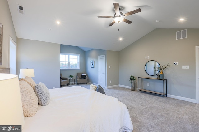 bedroom featuring lofted ceiling, light colored carpet, and ceiling fan