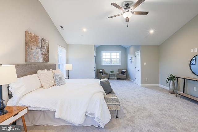 bedroom featuring lofted ceiling, light colored carpet, and ceiling fan