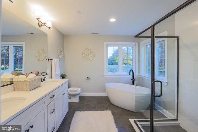 full bathroom featuring vanity, plus walk in shower, toilet, and tile patterned floors