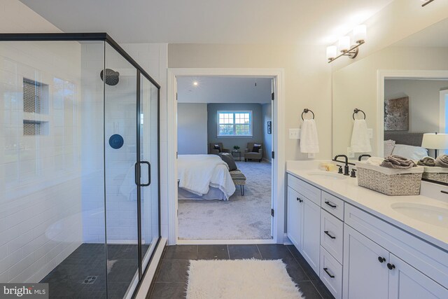 bathroom featuring vanity, a shower with shower door, and tile patterned flooring