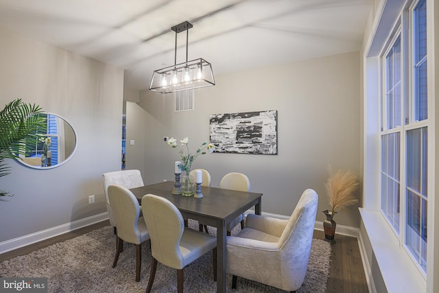 dining area featuring dark hardwood / wood-style floors